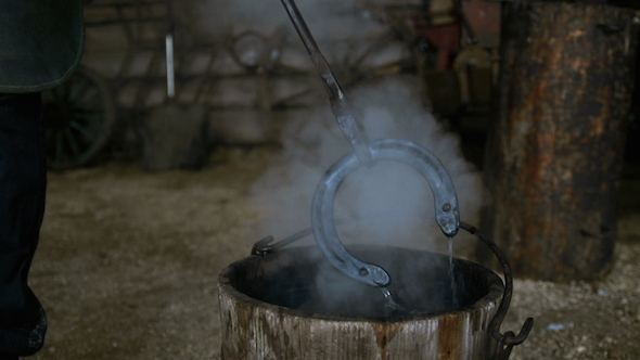 Blacksmith Bathe a Horseshoe