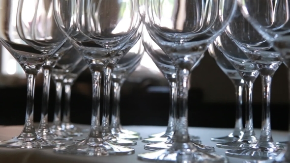 Lot Of Glasses On The Table With White Tablecloth