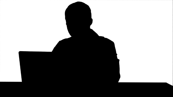 Silhouette Concentrated Male Doctor Using Laptop