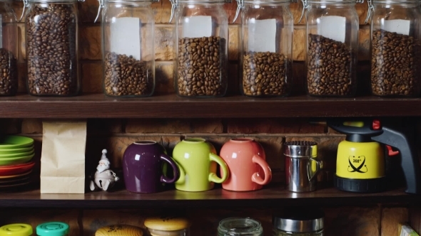 Glass Jars With Coffee Stand On a Shelf alt