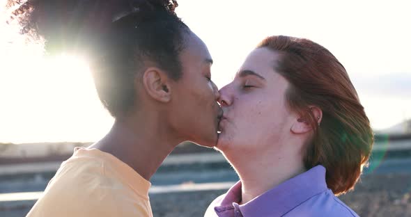 Lesbian couple having tender moment outdoor