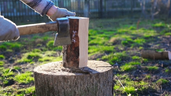 A Man Chops Wood