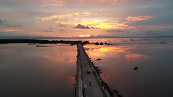 Drone View Over a Pier at Dusk with Astonishing Twilight Sky