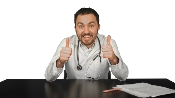 Smiling Male Doctor At Medical Office On White