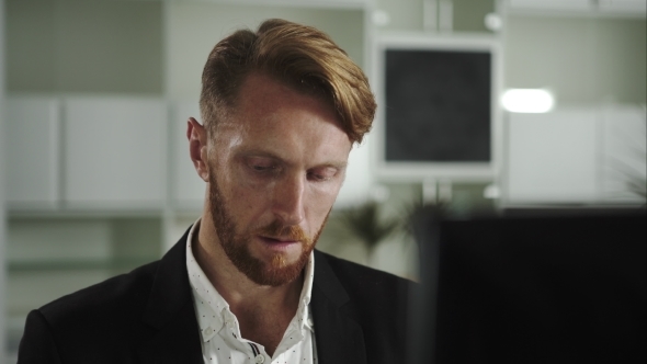 Focused Man Working At a Computer