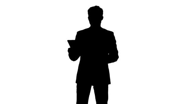 Silhouette Businessman Using His Tablet
