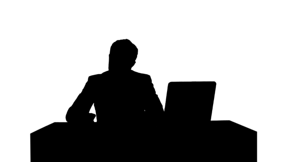 Silhouette Human Hand Writing On a Paper With