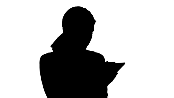 Silhouette Young Woman Using a Tablet