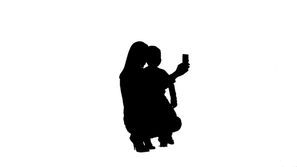 Silhouette Mother And Son Posing For Selfie 