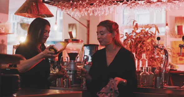 Waitresses having afterhours drink