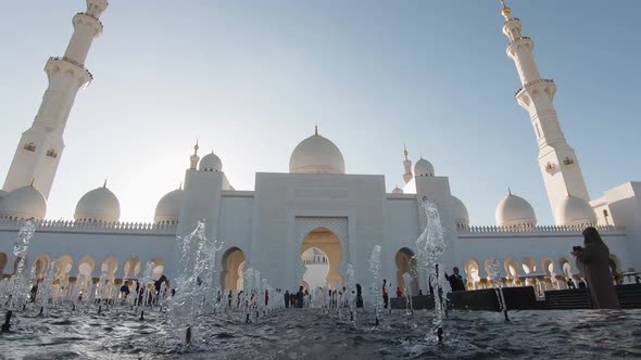 Tourists at the Sheikh Zayed bin Sultan Al Nahyan Grand Mosque, Abu Dhabi, United Arab Emirates