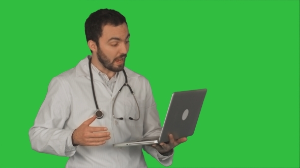 Doctor Having Video Conference On Laptop With