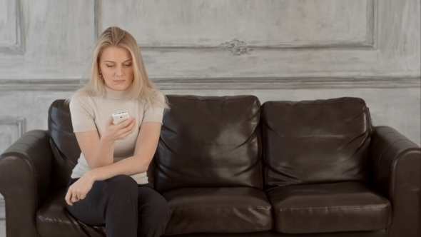 Woman Waiting For The Doctor In Hospital Lobby On