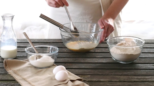 Woman Mixes Ingredients For Sponge Cake