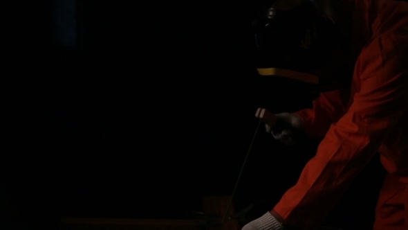 Worker Welding Some Metal Construction alt