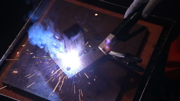 Worker Welding Some Metal Constructions alt