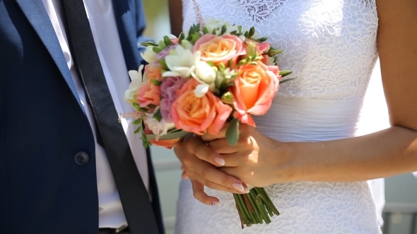 The Bride And Groom Holding Hands