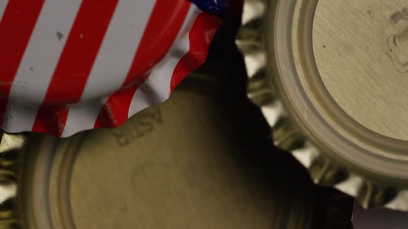 Rotating shot of bottle caps with the American flag printed on them 