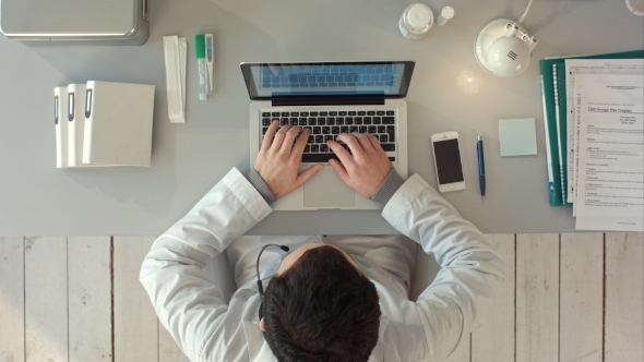 Top View Of Medical Worker With Laptop. Doctors