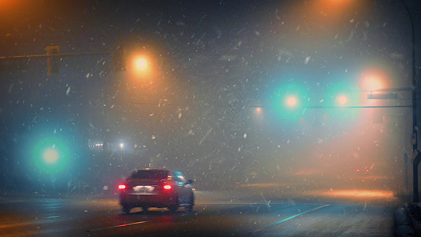 Cars On Highway At Night In Snowy Weather alt