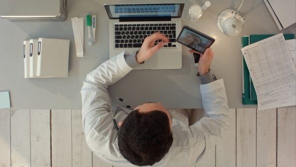 Doctor Videochatting With Senior Colleague