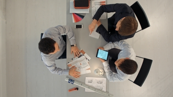 Team Of Architects Working On Construction Plans alt