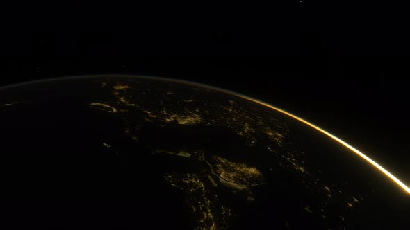 Spaceship Flies Over the Night Side of the Planet Earth