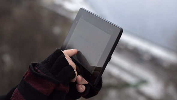 Man Using Tablet Outdoors