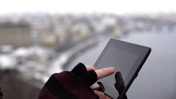 Man Typing On The Tablet