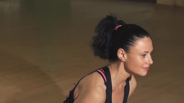 Cheerful Beautiful Woman Smiling Practicing Yoga at Home