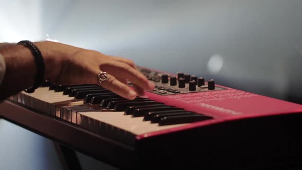 Male Hands Playing on Synthesizer Piano