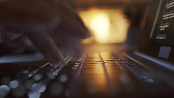 Timelapse of Hands of Woman Writing Code on Laptop Illuminated by Lamp