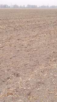 Vertical Video of a Field with Plowed Land in Autumn Slow Motion