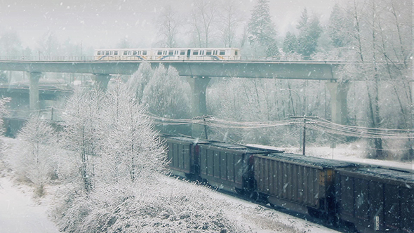 Freight Train And Subway Passing In The Snow