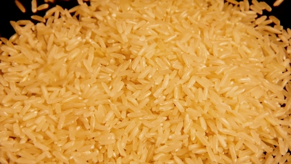 Dry Raw Rice Paddy Grains Pour And Spin Slowly alt