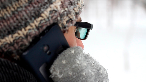 Man Speaks On The Phone In The Winter alt