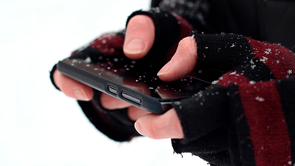 Man Uses a Phone Winter