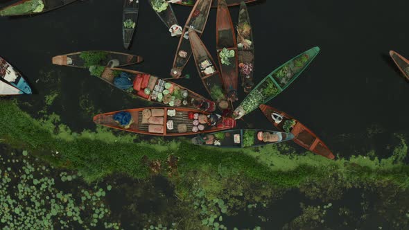 Aerial view of People on typical boats along the river, Rainawari, Srinagar.