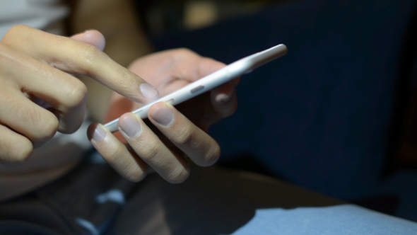 Typing on Phone at Night alt