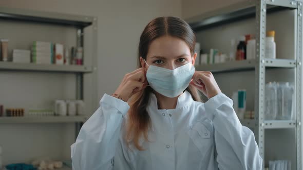 Woman Happily Removes the Protective Medical Mask From the Face at the Pharmacy