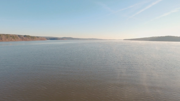 Drone Flying Over Lake