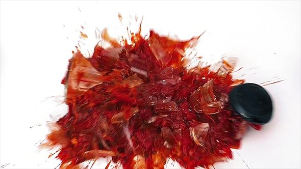 Jar Of Pasta Sauce Smashes On White Surface