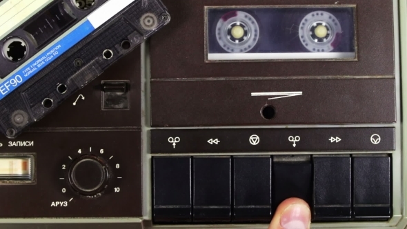 Tape Recorder Playing With Silver Cassette