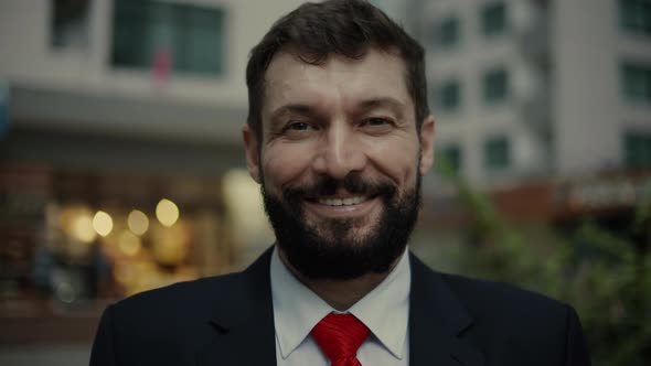 Portrait Happy Senior Businessman in an Expensive Suit in a Red Tie a Handsome Bearded Senior