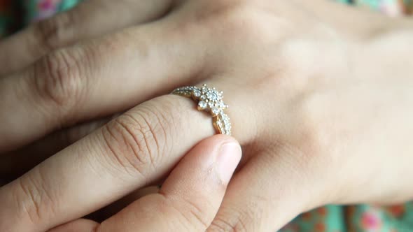 Close Up of Women's Hands with Wedding Ring