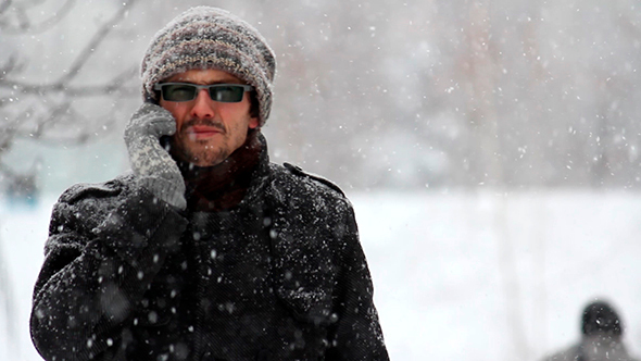 Man Speaks On The Phone In The Winter alt