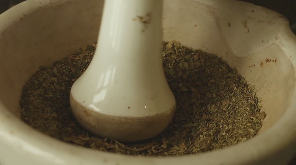 Hands Rubbed The Herbs in a Mortar