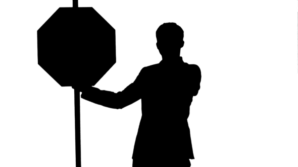 Silhouette A Businessman Holding a Stop Sign On