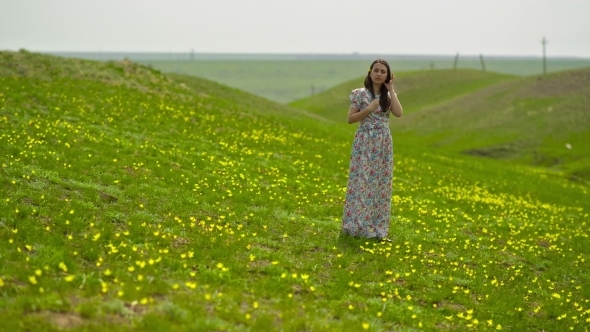 Woman In a Long Dress In a Meadow