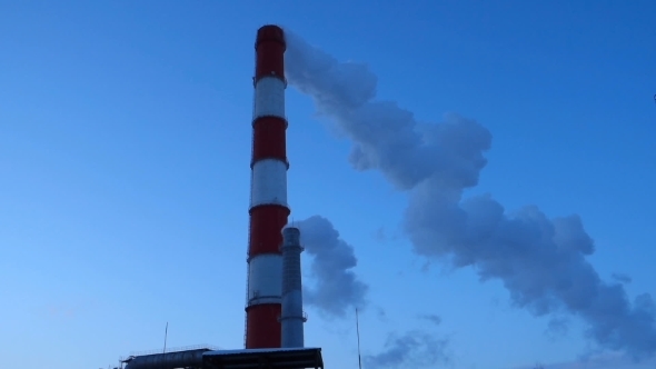 Two Smoking Chimneys CHP At Dusk